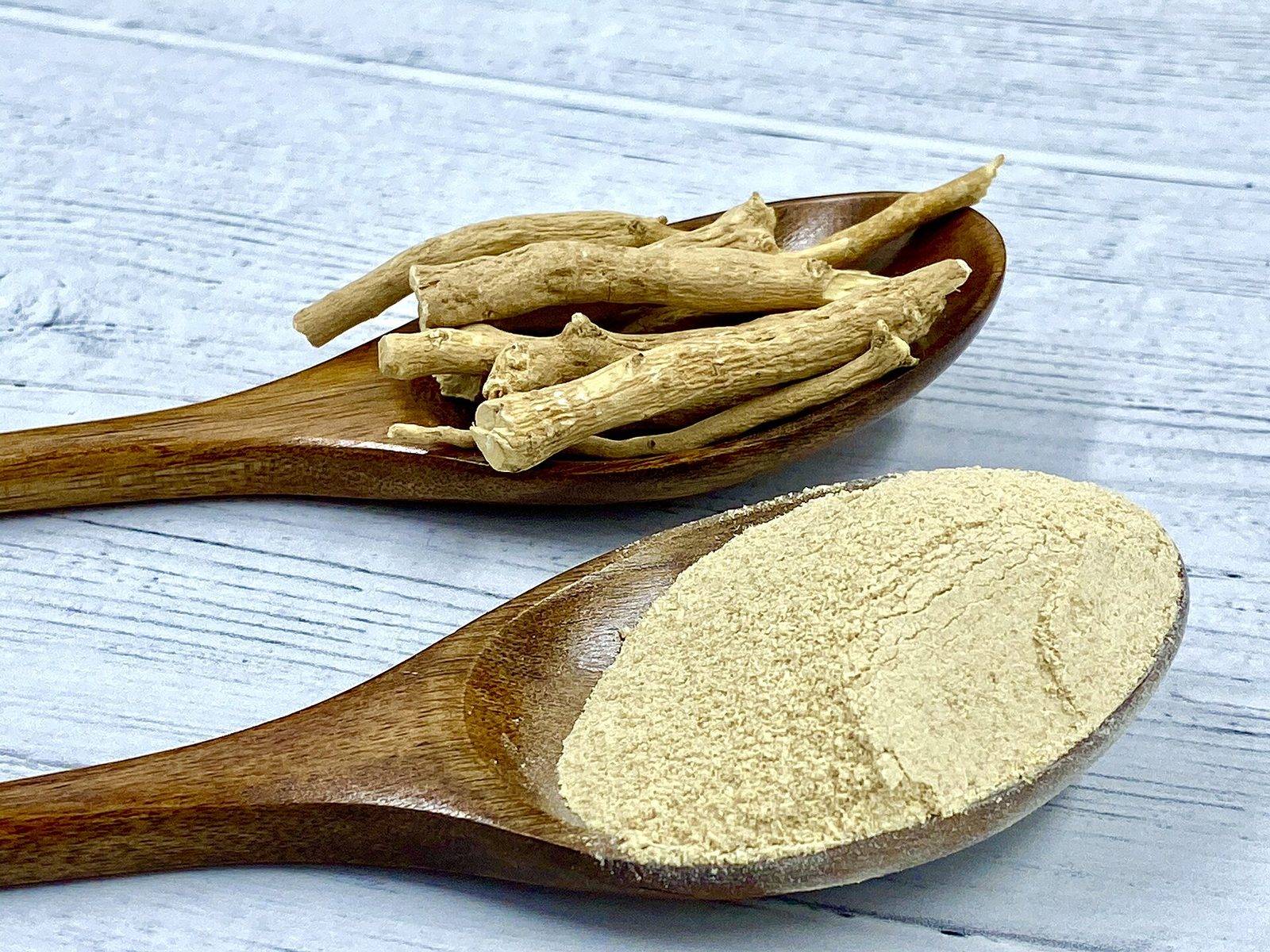 Ashwagandha root and powder on wooden spoons